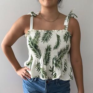 Peplum top with palm leaf print